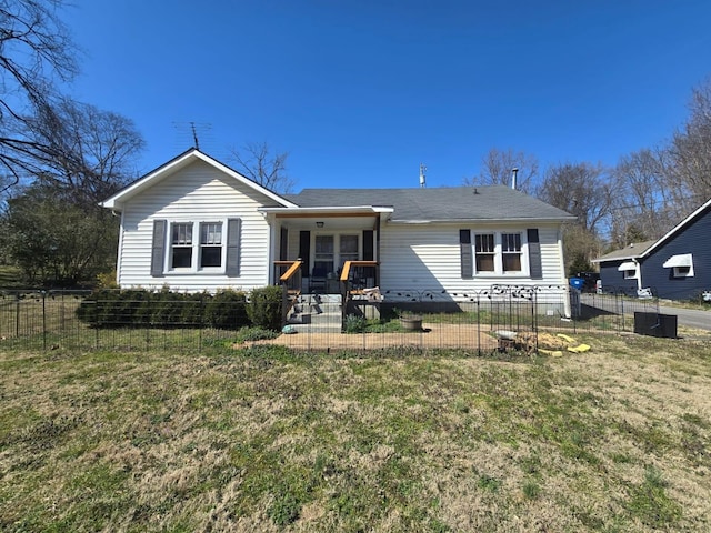 view of front of house featuring a front yard and a fenced front yard