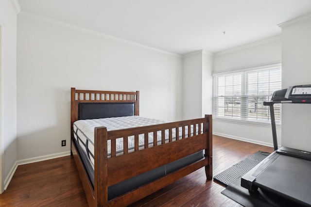 bedroom featuring baseboards, hardwood / wood-style floors, and ornamental molding