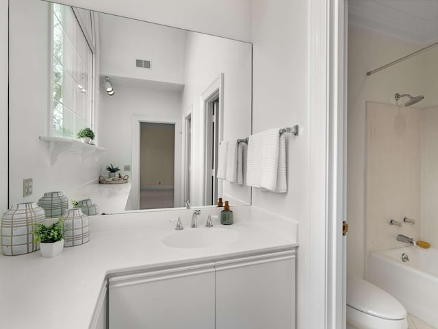 bathroom with visible vents, toilet, vanity, and bathtub / shower combination