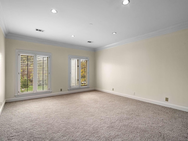 carpeted empty room featuring recessed lighting, visible vents, baseboards, and ornamental molding