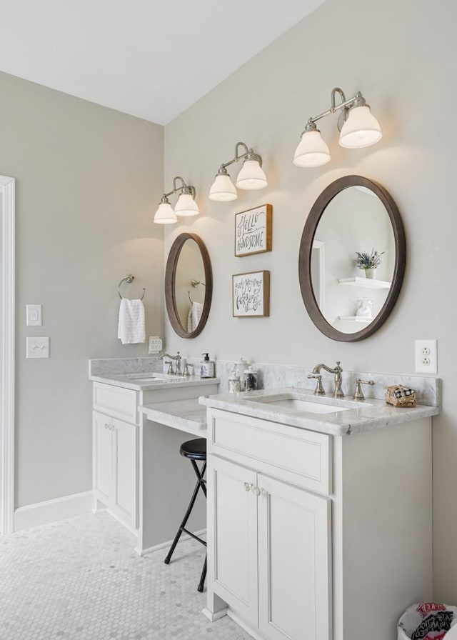 bathroom with vanity and baseboards