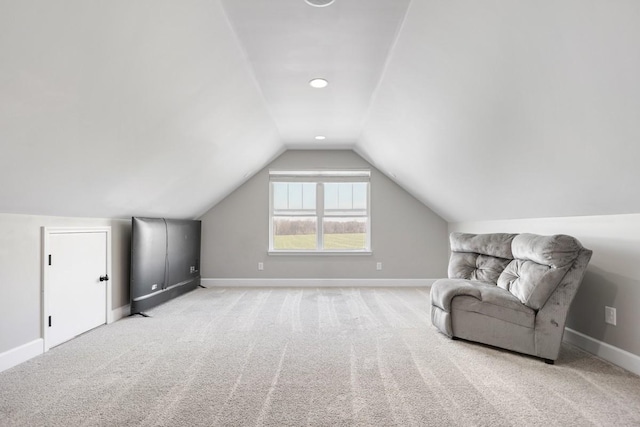 sitting room featuring lofted ceiling, carpet flooring, and baseboards