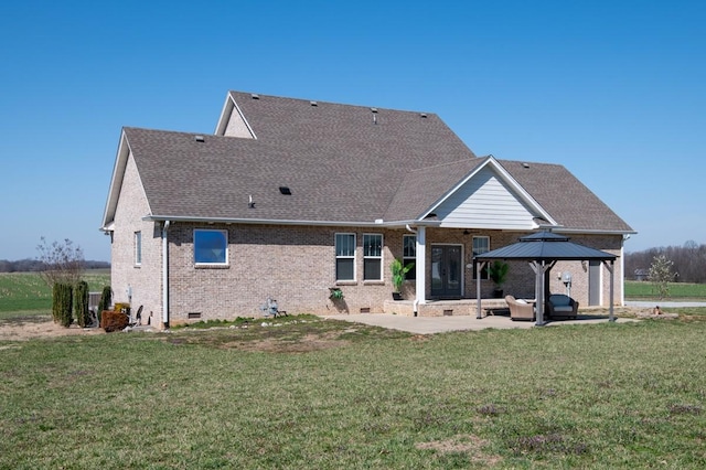 back of house featuring a gazebo, a yard, crawl space, brick siding, and a patio area