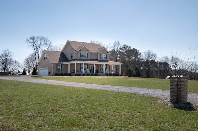 view of front of home featuring a porch, a front lawn, and driveway