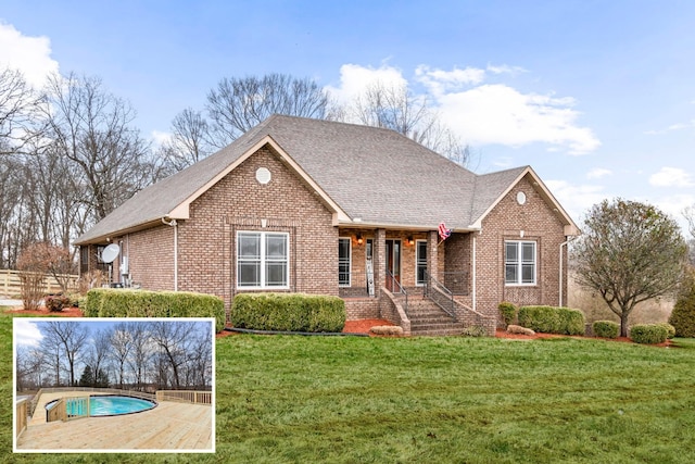 view of front of house with brick siding, a shingled roof, and a front yard