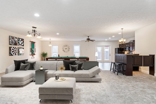 living room with recessed lighting, light colored carpet, pool table, and baseboards