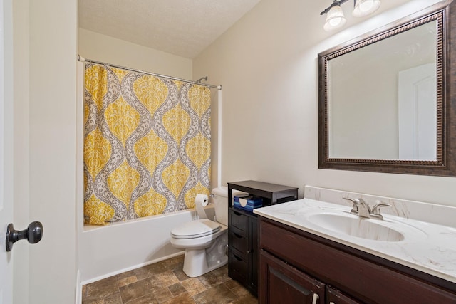bathroom featuring toilet, shower / bath combo, stone finish floor, a textured ceiling, and vanity