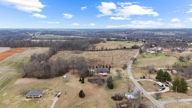 birds eye view of property with a rural view