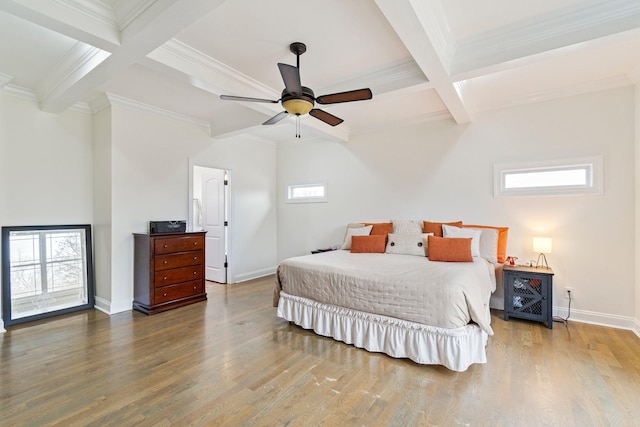 bedroom with beamed ceiling, baseboards, coffered ceiling, and wood finished floors