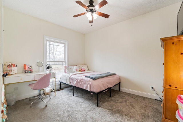 bedroom with ceiling fan, baseboards, and carpet floors