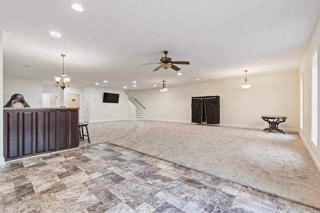 living area featuring light carpet, stairway, ceiling fan, and baseboards