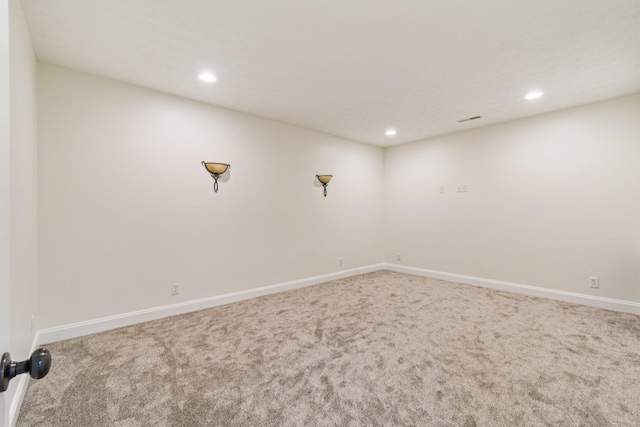 unfurnished room featuring recessed lighting, carpet, and baseboards