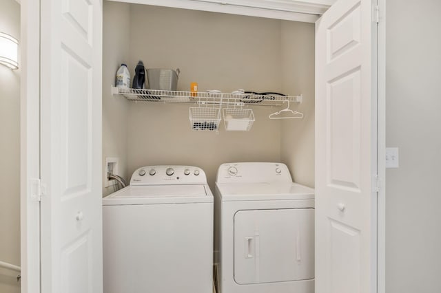 clothes washing area featuring laundry area and separate washer and dryer