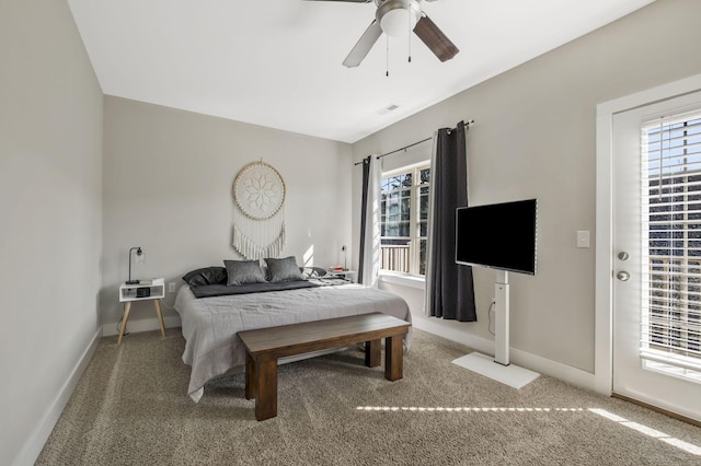 carpeted bedroom with multiple windows, baseboards, and ceiling fan