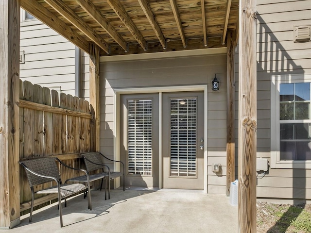 view of patio featuring fence