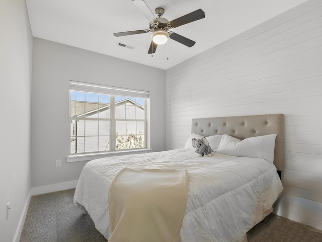 bedroom with visible vents, carpet flooring, baseboards, and ceiling fan