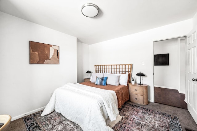 carpeted bedroom with baseboards