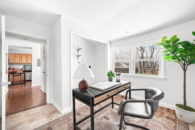 office featuring light tile patterned floors and baseboards