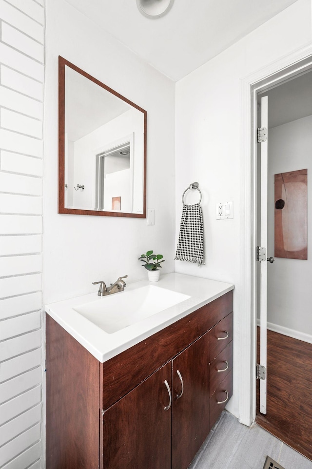 bathroom featuring vanity and wood finished floors