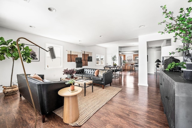 living room with recessed lighting and wood finished floors