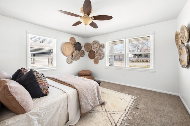 bedroom with baseboards, carpet, and a ceiling fan