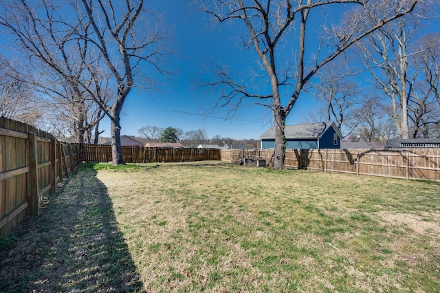 view of yard featuring a fenced backyard