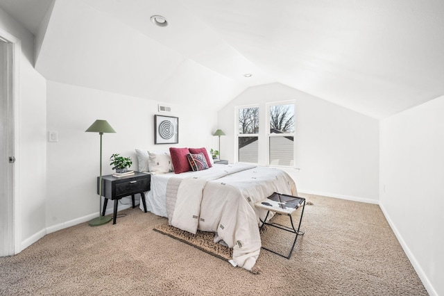 bedroom featuring visible vents, baseboards, lofted ceiling, and carpet floors