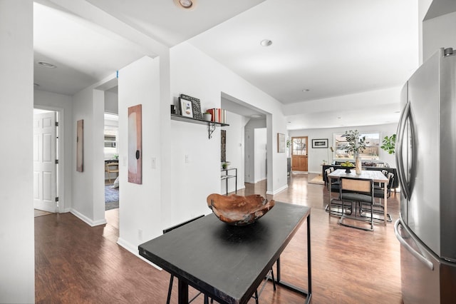 dining room featuring recessed lighting, baseboards, and wood finished floors