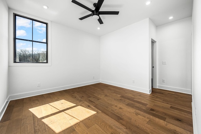 spare room with recessed lighting, baseboards, dark wood-type flooring, and a ceiling fan