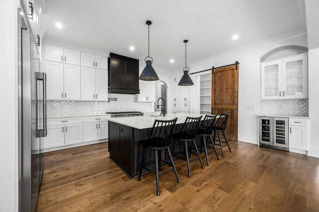 kitchen with premium range hood, beverage cooler, smart refrigerator, dark wood-style floors, and a barn door