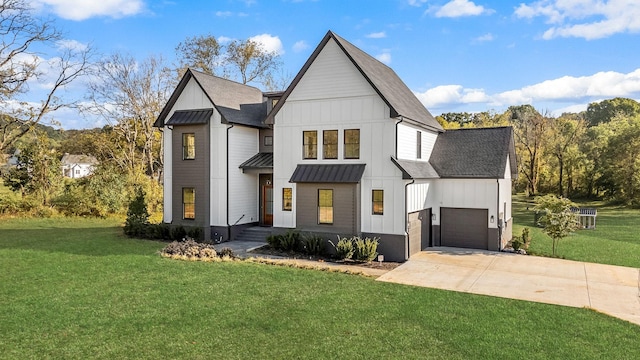 modern inspired farmhouse with a front yard, a garage, board and batten siding, and driveway