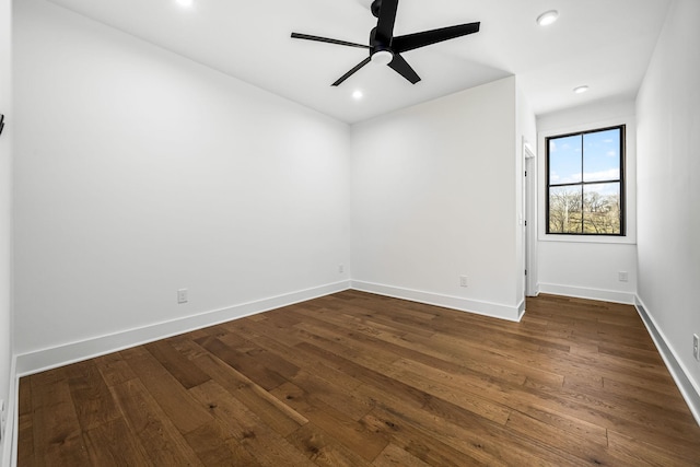 unfurnished room featuring recessed lighting, a ceiling fan, dark wood-type flooring, and baseboards