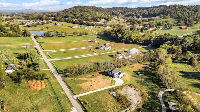 drone / aerial view with a water view and a rural view