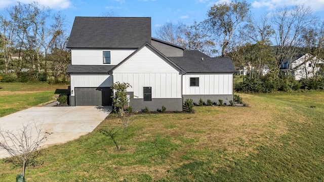 view of home's exterior with a lawn, board and batten siding, concrete driveway, an attached garage, and roof with shingles