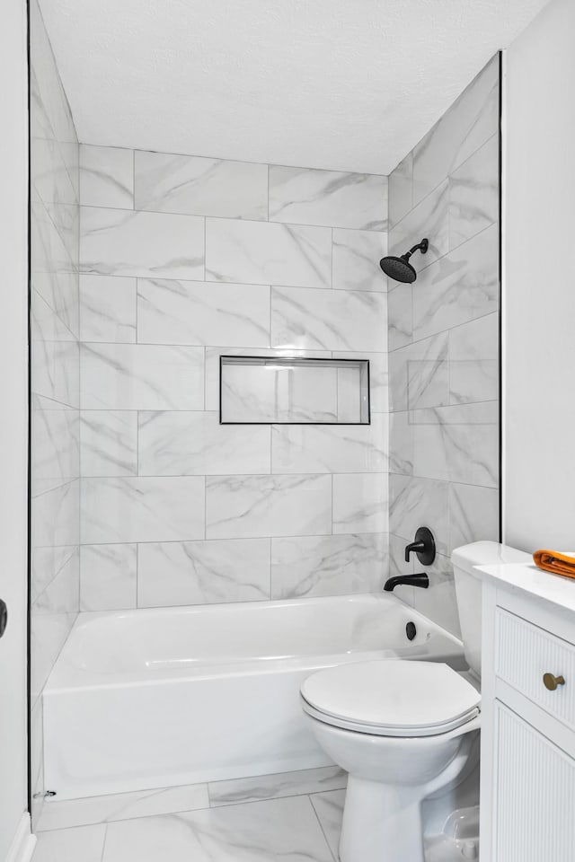 full bath featuring vanity, toilet, marble finish floor, and shower / bathtub combination