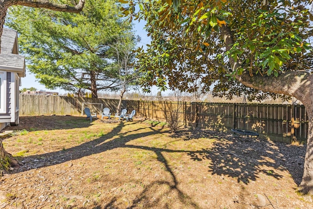 view of yard with a fenced backyard