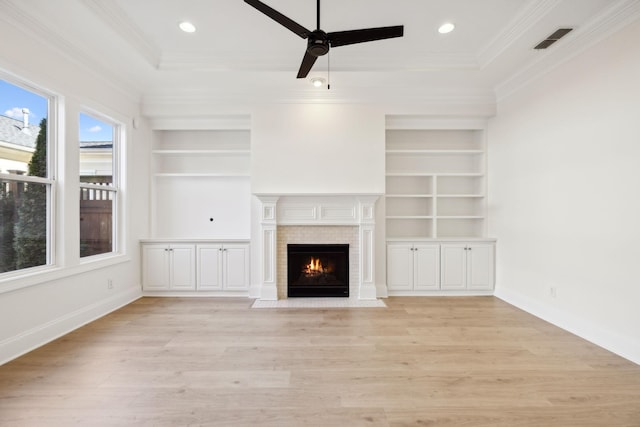 unfurnished living room featuring visible vents, ceiling fan, baseboards, a fireplace with flush hearth, and light wood-style flooring