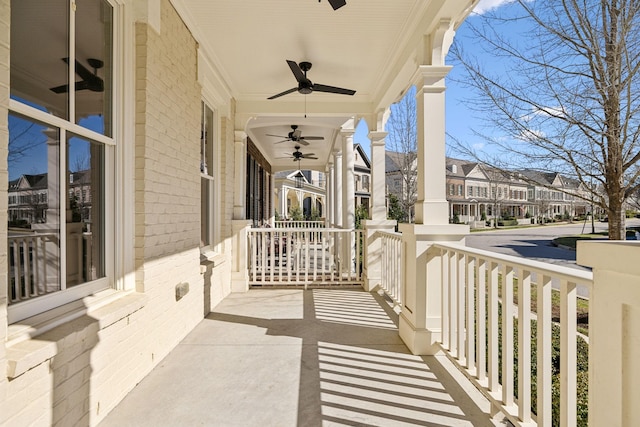 view of patio / terrace featuring a residential view, a porch, and ceiling fan