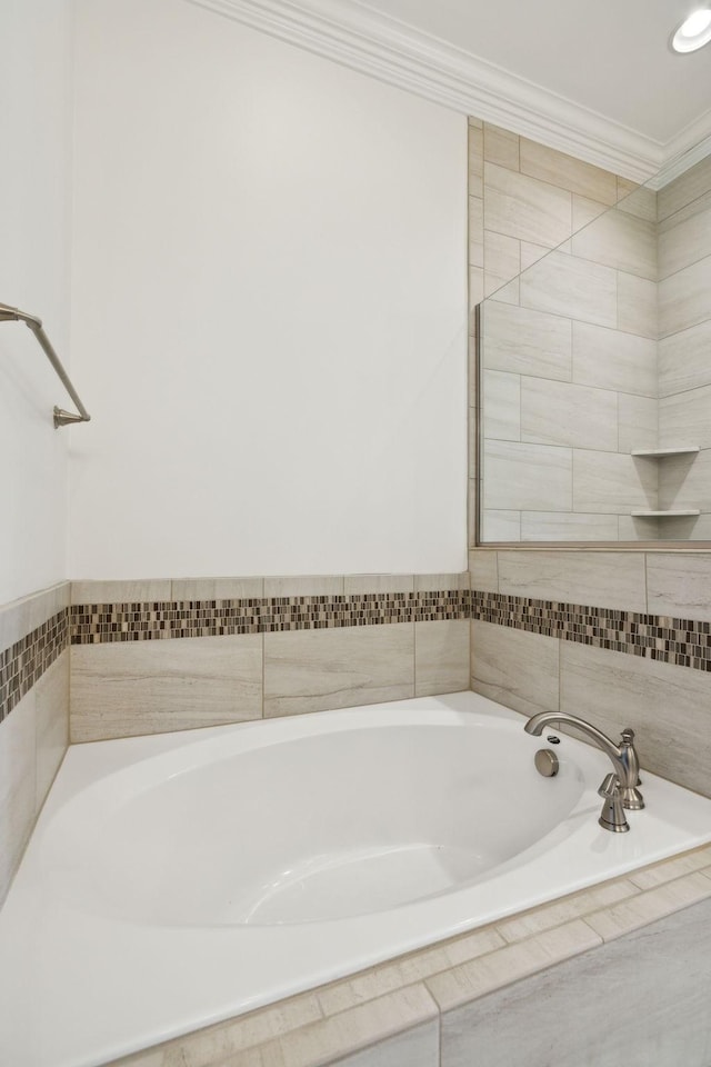 full bathroom featuring crown molding and a garden tub