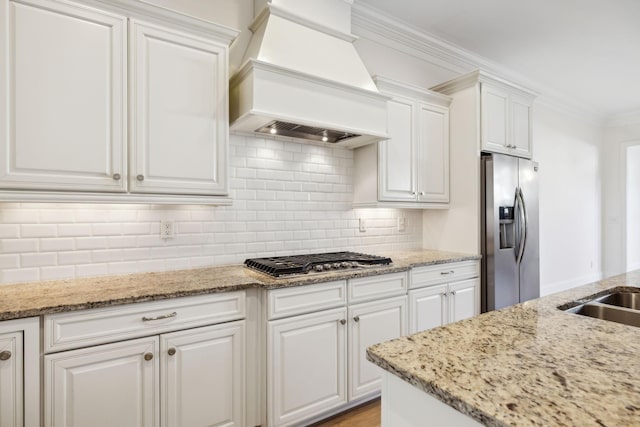 kitchen with backsplash, ornamental molding, stainless steel appliances, custom exhaust hood, and white cabinetry