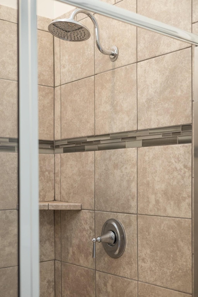 room details with a tile shower