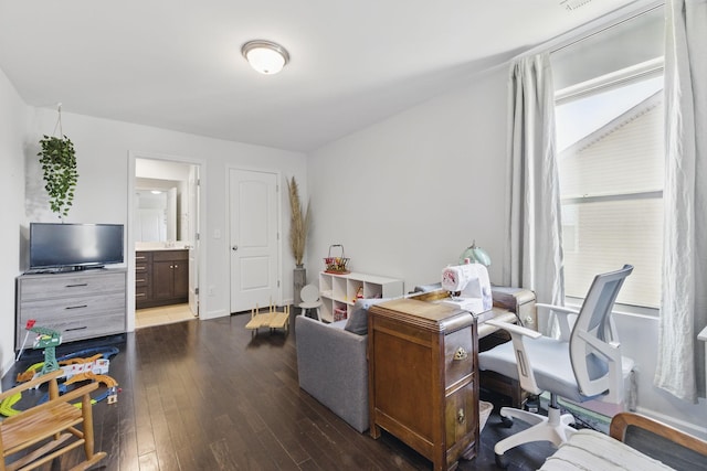 office area with baseboards and wood-type flooring