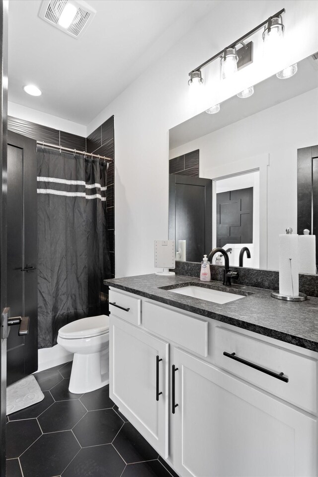 3018 Indiana Ave, Nashville, TN 37209 - full bath featuring toilet, vanity, a shower with curtain, and tile patterned floors