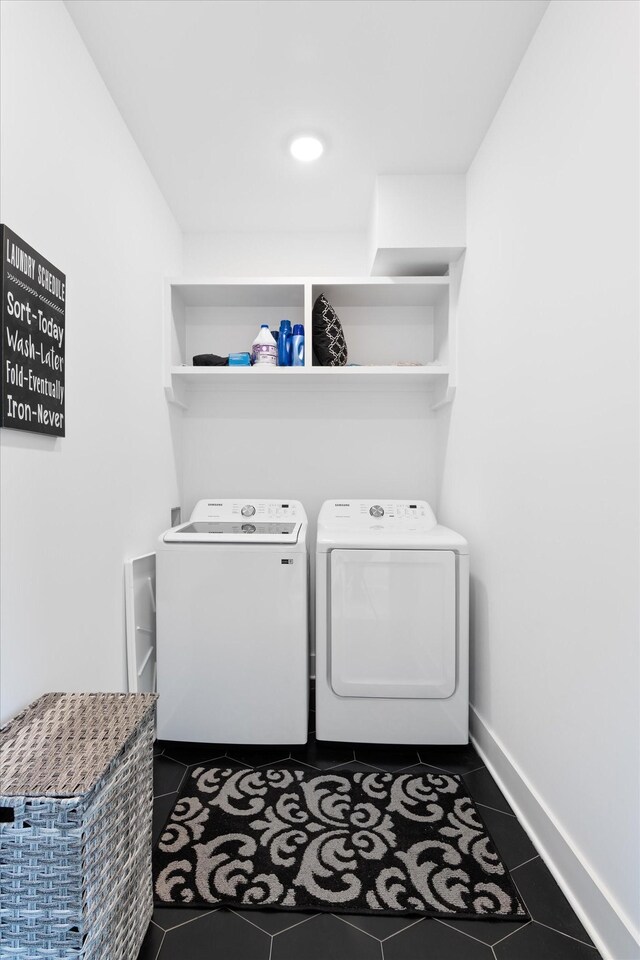 3018 Indiana Ave, Nashville, TN 37209 - laundry room featuring washing machine and clothes dryer, dark tile patterned flooring, and baseboards