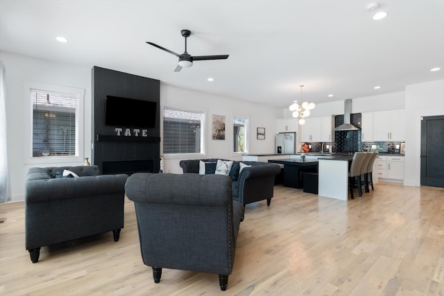 3018 Indiana Ave, Nashville, TN 37209 - living area with healthy amount of natural light, light wood-type flooring, a ceiling fan, a chandelier, and recessed lighting