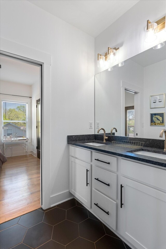 3018 Indiana Ave, Nashville, TN 37209 - bathroom featuring double vanity, baseboards, and tile patterned floors