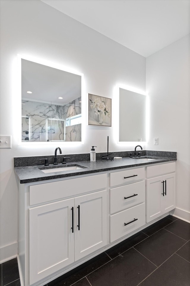 3018 Indiana Ave, Nashville, TN 37209 - bathroom featuring a marble finish shower, double vanity, baseboards, and tile patterned flooring