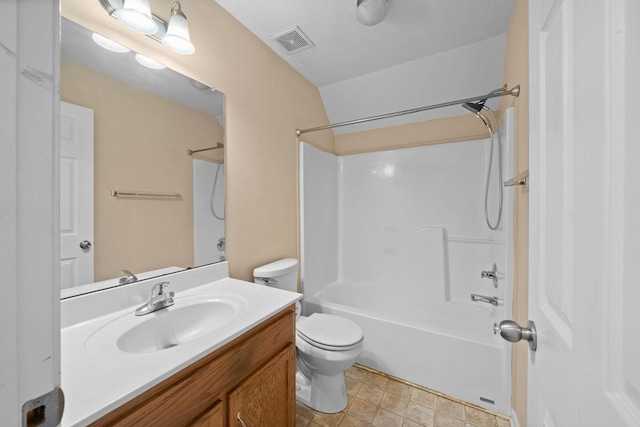 bathroom with vanity, toilet, washtub / shower combination, and visible vents