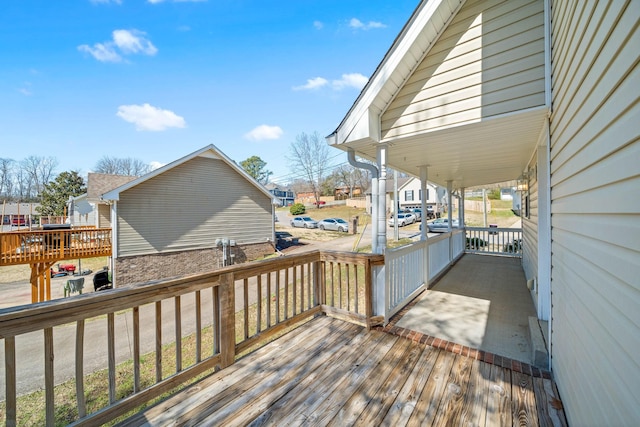 wooden terrace featuring a residential view