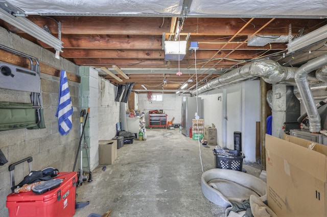 basement featuring freestanding refrigerator